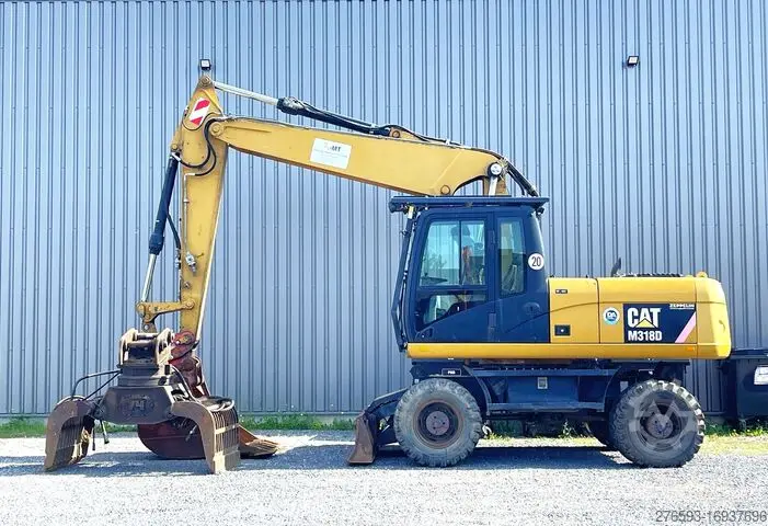Аренда колесного экскаватора Caterpillar M318F с грейфером